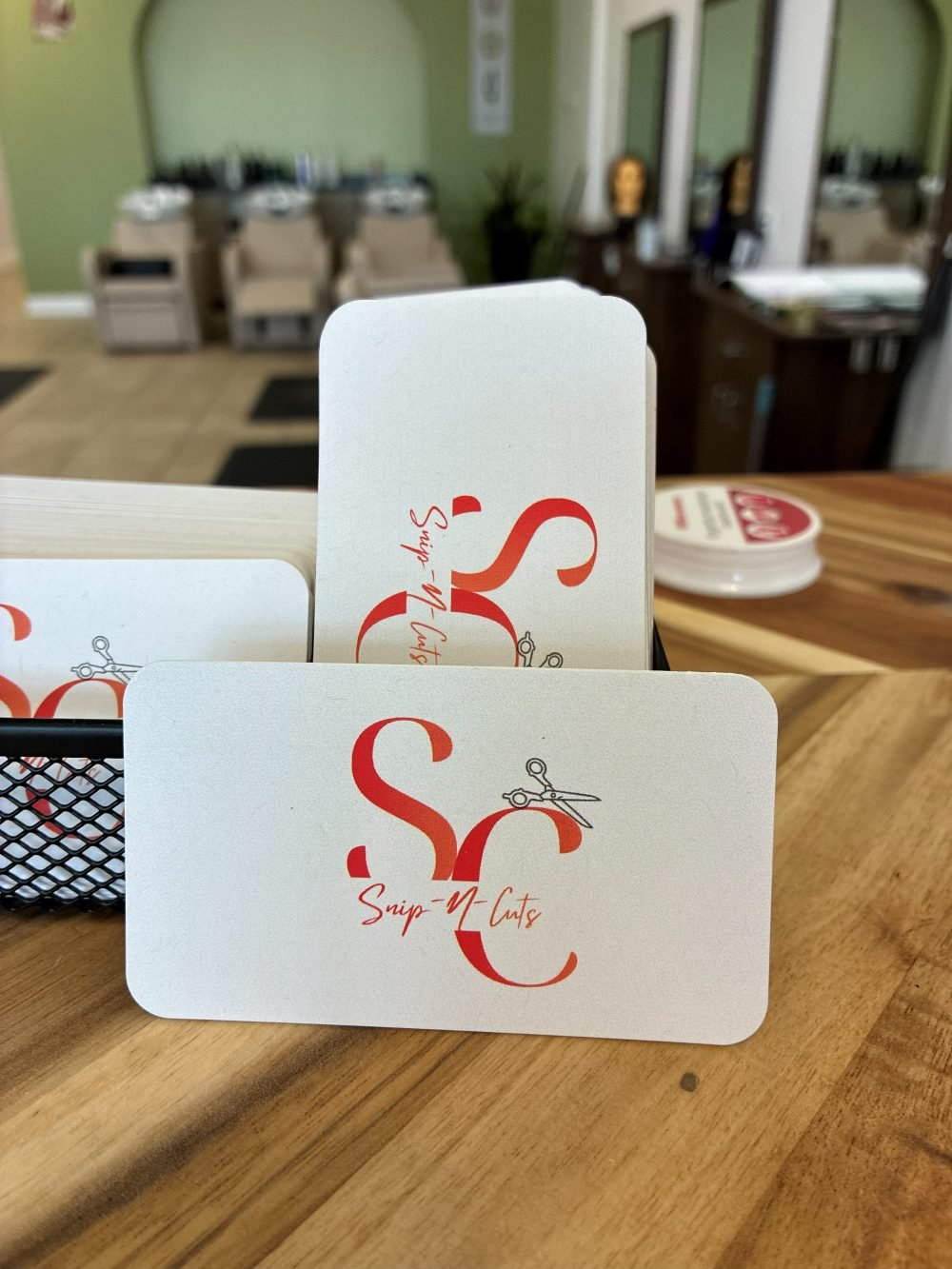 Snip-N-Cuts business cards on the front counter